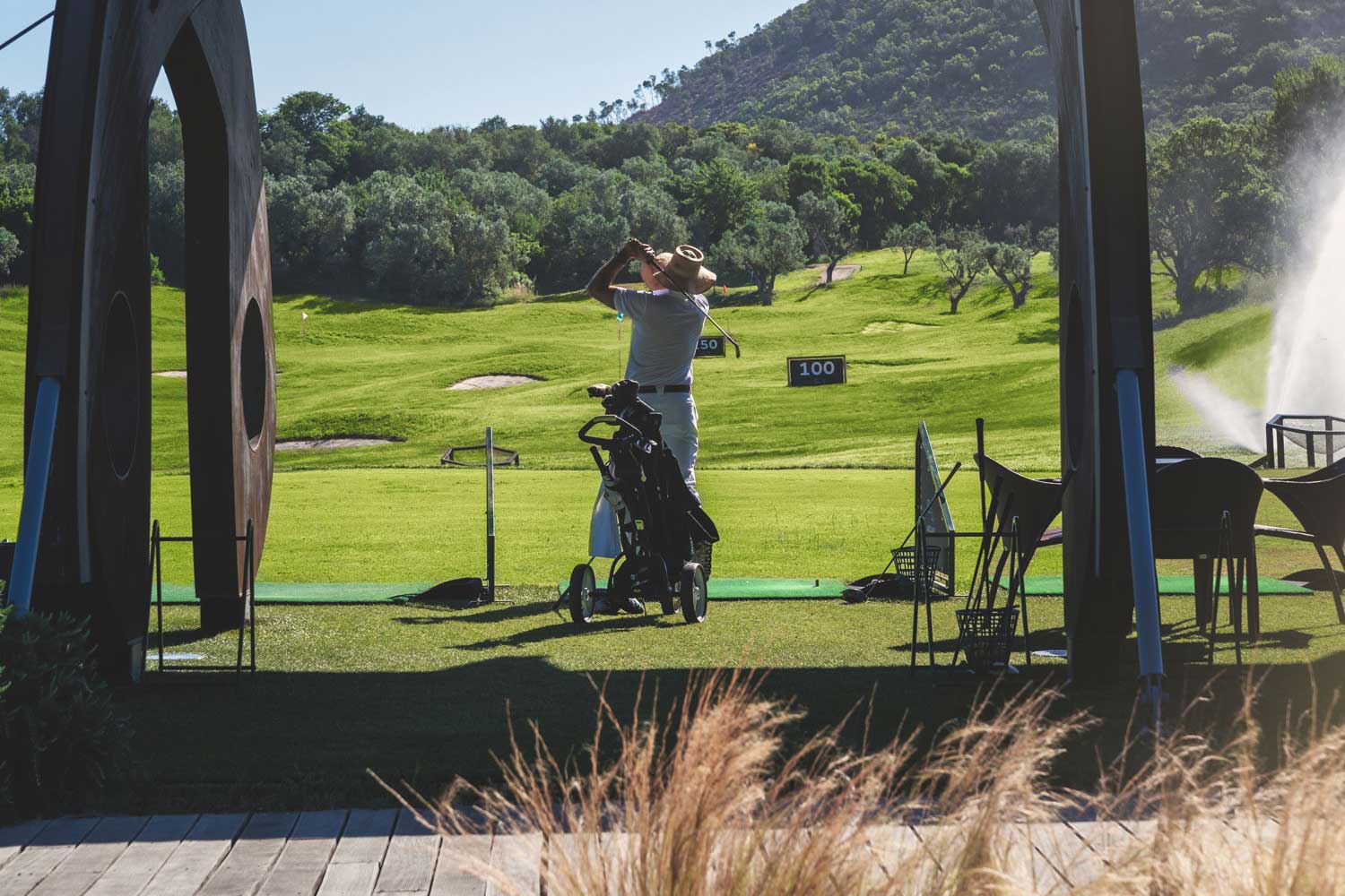 golfer in the driving range booked golf packages in italy